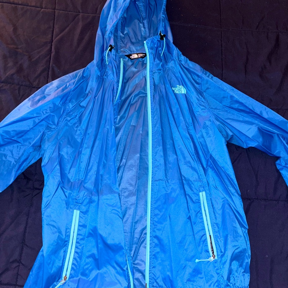 Blue North Face windbreaker jacket